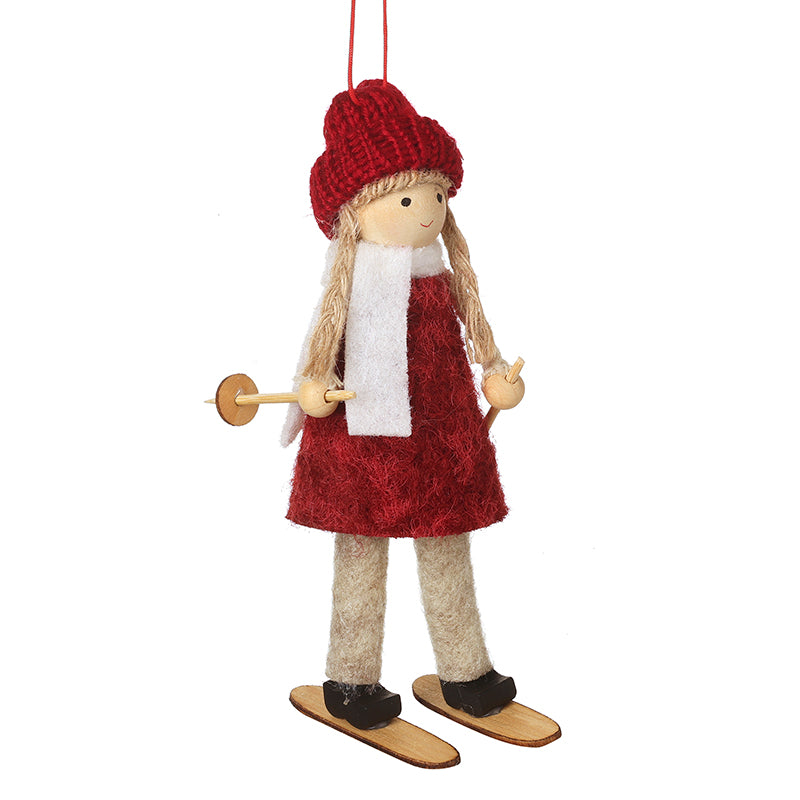 HANGING GIRL IN RED HAT & DRESS ON SKIS