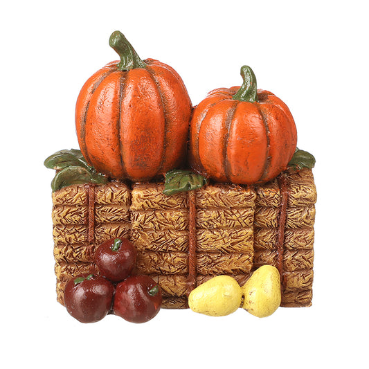 ORANGE PUMPKINS ON HAY BALE DEC