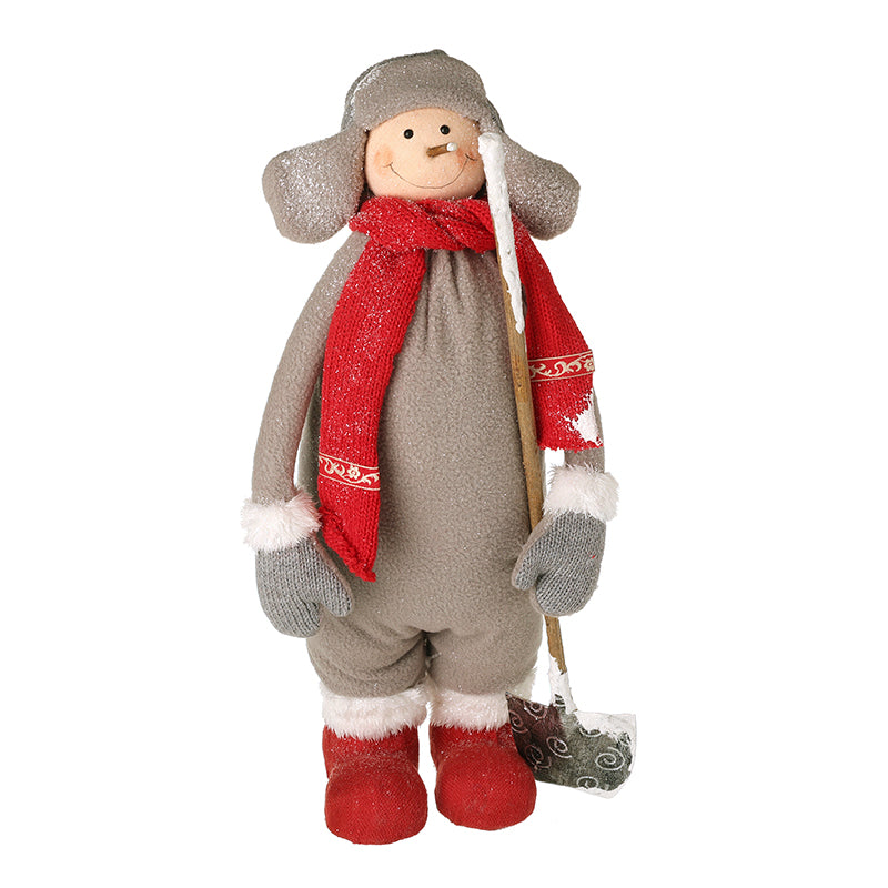 BOY IN GREY SUIT WITH SNOW SHOVEL