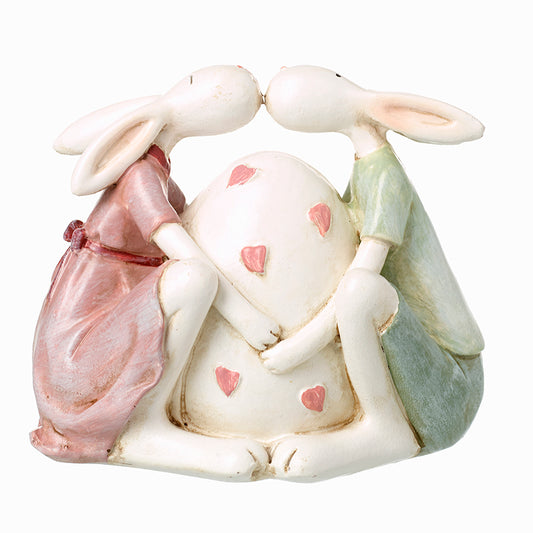 Sitting Rabbits With Large Egg