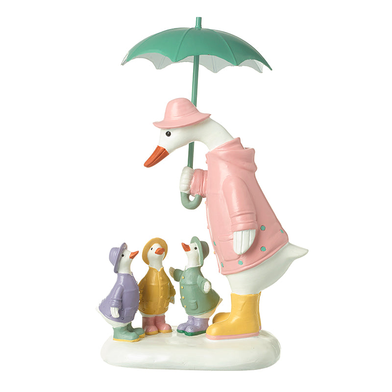 Duck Family Under Umbrella
